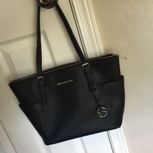 Black Michael Kors Jet Set tote. Good condition. Silver tone hardware.